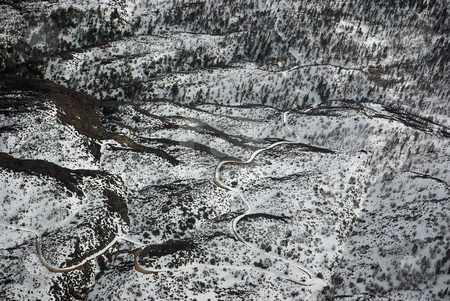 To use this stock image in your creative project, please select the size you need over to the right and click the "Add to Cart" button.
Your downloaded image will come with the Cutcaster watermark removed so don’t worry about the watermark you see on this page. Snow-Covered Road, Aerial View stock photo, A curvy snow-covered road in Southern California, late winter. by Kristine Keller