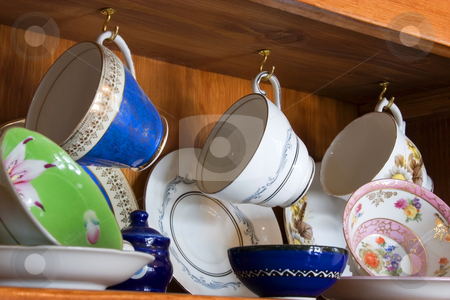 To use this stock image in your creative project, please select the size you need over to the right and click the "Add to Cart" button.
Your downloaded image will come with the Cutcaster watermark removed so don’t worry about the watermark you see on this page. China Cabinet full of Cups stock photo, Tea and Coffee Cups by Mehmet Dilsiz
