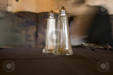 To use this stock image in your creative project, please select the size you need over to the right and click the "Add to Cart" button.
Your downloaded image will come with the Cutcaster watermark removed so don’t worry about the watermark you see on this page. Salt and pepper shaker stock photo, Salt and pepper shaker on the table with blurry background by Mehmet Dilsiz