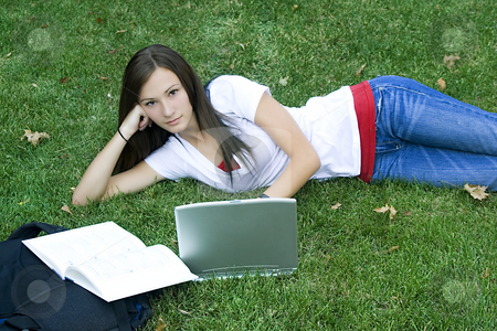 To use this stock image in your creative project, please select the size you need over to the right and click the "Add to Cart" button.
Your downloaded image will come with the Cutcaster watermark removed so don’t worry about the watermark you see on this page. Cute teen girl laying down on the grass studying stock photo, Cute teen girl laying down on the grass studying with her laptop by Mehmet Dilsiz
