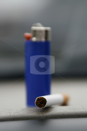 To use this stock image in your creative project, please select the size you need over to the right and click the "Add to Cart" button.
Your downloaded image will come with the Cutcaster watermark removed so don’t worry about the watermark you see on this page. Blue Lighter and a Cigarette stock photo, Blue lighter standing with a cigarette on the deck by Mehmet Dilsiz