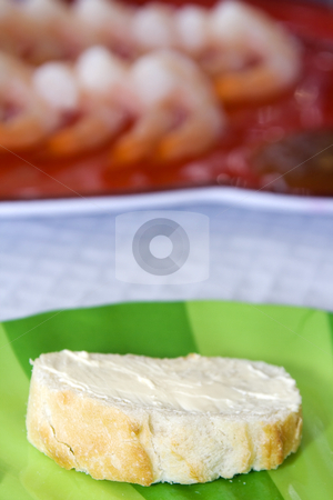 To use this stock image in your creative project, please select the size you need over to the right and click the "Add to Cart" button.
Your downloaded image will come with the Cutcaster watermark removed so don’t worry about the watermark you see on this page. Close up on sliced bread on a table stock photo, Close up on a sliced bread with blurred shrimps on the background by Mehmet Dilsiz