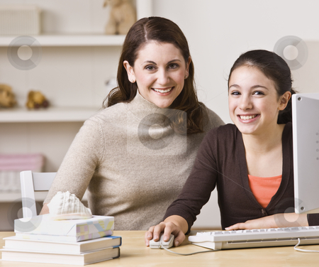 To use this stock image in your creative project, please select the size you need over to the right and click the "Add to Cart" button.
Your downloaded image will come with the Cutcaster watermark removed so don’t worry about the watermark you see on this page. Mother and Daughter on Laptop stock photo, A mother and her daughter are working together on a laptop. They are smiling at the camera. Horizontally framed shot. by Jonathan Ross