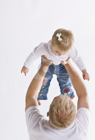 To use this stock image in your creative project, please select the size you need over to the right and click the "Add to Cart" button.
Your downloaded image will come with the Cutcaster watermark removed so don’t worry about the watermark you see on this page. Father Holding Daughter stock photo, A father is holding up his daughter. They are looking at each other. Vertically framed shot. by Jonathan Ross