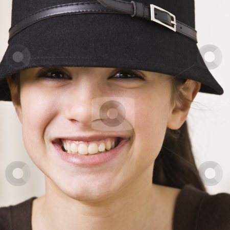 To use this stock image in your creative project, please select the size you need over to the right and click the "Add to Cart" button.
Your downloaded image will come with the Cutcaster watermark removed so don’t worry about the watermark you see on this page. Girl Wearing Hat stock photo, A young girl is wearing a hat and smiling at the camera. Square composition. by Jonathan Ross