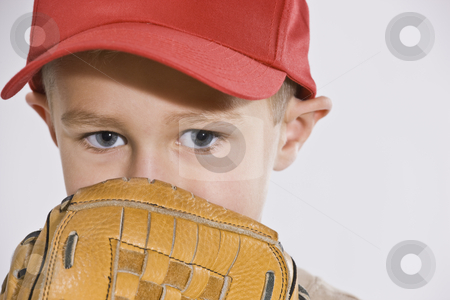 To use this stock image in your creative project, please select the size you need over to the right and click the "Add to Cart" button.
Your downloaded image will come with the Cutcaster watermark removed so don’t worry about the watermark you see on this page. Boy with Mitt and Baseball Cap stock photo, A young boy is wearing a baseball cap and holding a baseball mitt up to his face. Horizontally framed shot. by Jonathan Ross