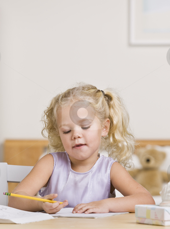 To use this stock image in your creative project, please select the size you need over to the right and click the "Add to Cart" button.
Your downloaded image will come with the Cutcaster watermark removed so don’t worry about the watermark you see on this page. Beautiful Little Girl Writing stock photo, A beautiful little girl writing in a notebook at a desk. Vertically framed shot. by Jonathan Ross