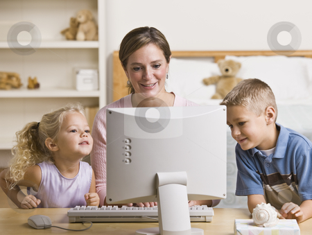To use this stock image in your creative project, please select the size you need over to the right and click the "Add to Cart" button.
Your downloaded image will come with the Cutcaster watermark removed so don’t worry about the watermark you see on this page. Woman and Children Playing on Computer stock photo, A mother and her two children are playing together on a computer. They are smiling and lookign at the screen. Horizontally framed shot. by Jonathan Ross