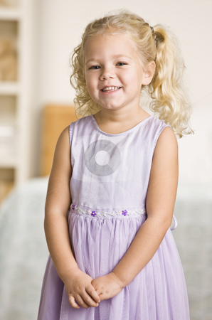 To use this stock image in your creative project, please select the size you need over to the right and click the "Add to Cart" button.
Your downloaded image will come with the Cutcaster watermark removed so don’t worry about the watermark you see on this page. Girl Smiling at Camera stock photo, A young girl is standing in a room and smiling at the camera. Vertically framed shot. by Jonathan Ross