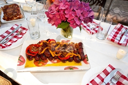 To use this stock image in your creative project, please select the size you need over to the right and click the "Add to Cart" button.
Your downloaded image will come with the Cutcaster watermark removed so don’t worry about the watermark you see on this page. Grilled kielbasa stock photo, Grilled kielbasa with batter fried bell pepper rings. by Mariusz Jurgielewicz