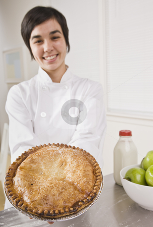 To use this stock image in your creative project, please select the size you need over to the right and click the "Add to Cart" button.
Your downloaded image will come with the Cutcaster watermark removed so don’t worry about the watermark you see on this page. Attractive woman holding pie. stock photo, Attractive woman showing pie to the camera and smiling. Vertical. by Jonathan Ross