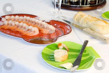To use this stock image in your creative project, please select the size you need over to the right and click the "Add to Cart" button.
Your downloaded image will come with the Cutcaster watermark removed so don’t worry about the watermark you see on this page. Shrimp Plate with Sliced Bread and Cocktail Set stock photo, Close up on a Table with Shrimp Plate with Sliced Bread and Cocktail Set by Mehmet Dilsiz