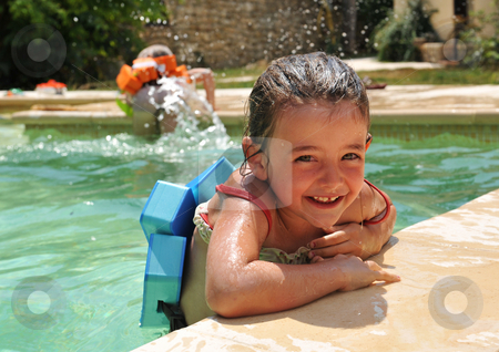 To use this stock image in your creative project, please select the size you need over to the right and click the "Add to Cart" button.
Your downloaded image will come with the Cutcaster watermark removed so don’t worry about the watermark you see on this page. Little girl in swimming pool stock photo, Smiling little girl in a swimming pool by Bonzami Emmanuelle