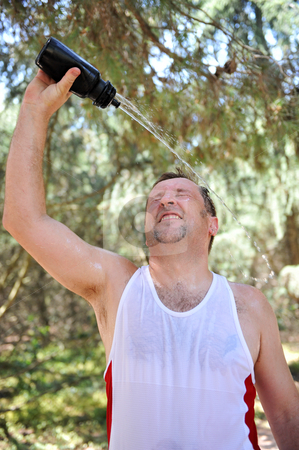 To use this stock image in your creative project, please select the size you need over to the right and click the "Add to Cart" button.
Your downloaded image will come with the Cutcaster watermark removed so don’t worry about the watermark you see on this page. Sport drink stock photo, Caucasian young man in a sport training with a bottle of water by Bonzami Emmanuelle