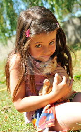 To use this stock image in your creative project, please select the size you need over to the right and click the "Add to Cart" button.
Your downloaded image will come with the Cutcaster watermark removed so don’t worry about the watermark you see on this page. Little girl and kitten stock photo, Little girl and kitten in a garden by Bonzami Emmanuelle