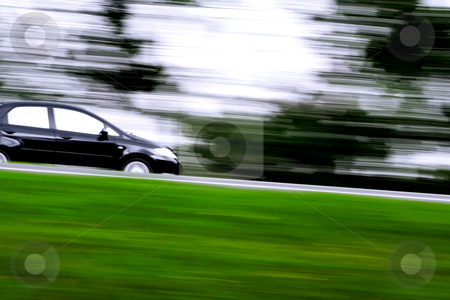 To use this stock image in your creative project, please select the size you need over to the right and click the "Add to Cart" button.
Your downloaded image will come with the Cutcaster watermark removed so don’t worry about the watermark you see on this page. Rushing away going downtown stock photo, A black car rushing away on a countryside highway by R. Eko Bintoro