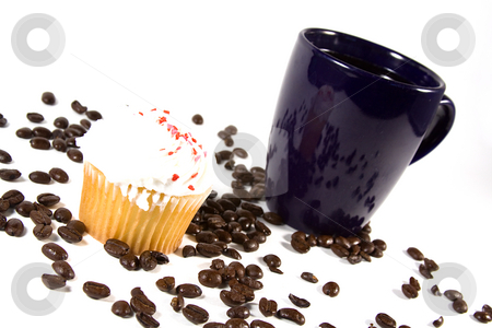 To use this stock image in your creative project, please select the size you need over to the right and click the "Add to Cart" button.
Your downloaded image will come with the Cutcaster watermark removed so don’t worry about the watermark you see on this page. Isolated Coffee Mug with Cupcake stock photo, Isolated Coffee Mug with beans and cupcakes by Mehmet Dilsiz