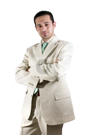 To use this stock image in your creative project, please select the size you need over to the right and click the "Add to Cart" button.
Your downloaded image will come with the Cutcaster watermark removed so don’t worry about the watermark you see on this page. Businessman posing with his arms crossed stock photo, Isolated Businessman posing with his arms crossed in a white suit by Mehmet Dilsiz