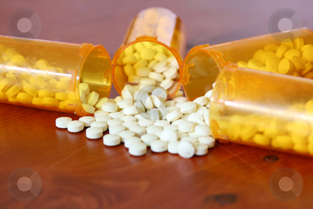 To use this stock image in your creative project, please select the size you need over to the right and click the "Add to Cart" button.
Your downloaded image will come with the Cutcaster watermark removed so don’t worry about the watermark you see on this page. Four Bottles of Medicine side by side stock photo, Medicine spilling out of four bottles by Mehmet Dilsiz