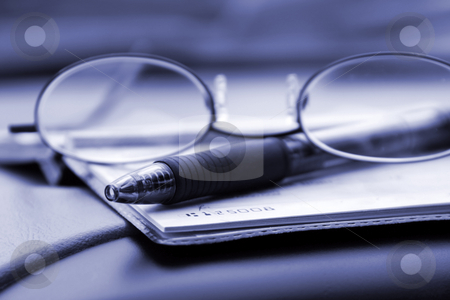 To use this stock image in your creative project, please select the size you need over to the right and click the "Add to Cart" button.
Your downloaded image will come with the Cutcaster watermark removed so don’t worry about the watermark you see on this page. Paying the Bills with Check stock photo, Close up on the Glasses and the Checkbook by Mehmet Dilsiz