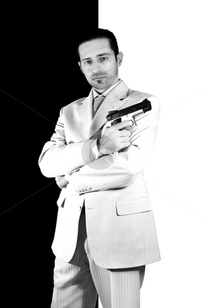 To use this stock image in your creative project, please select the size you need over to the right and click the "Add to Cart" button.
Your downloaded image will come with the Cutcaster watermark removed so don’t worry about the watermark you see on this page. Mafia with arms crossed and a gunon hand stock photo, Isolated Mafia with arms crossed and a gunon hand by Mehmet Dilsiz