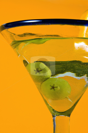 To use this stock image in your creative project, please select the size you need over to the right and click the "Add to Cart" button.
Your downloaded image will come with the Cutcaster watermark removed so don’t worry about the watermark you see on this page. Martini Glass stock photo, Martini Glass - Isolated on Orange Background by Mehmet Dilsiz