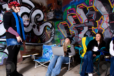 To use this stock image in your creative project, please select the size you need over to the right and click the "Add to Cart" button.
Your downloaded image will come with the Cutcaster watermark removed so don’t worry about the watermark you see on this page. Teeangers Hanging Out stock photo, One Teenager talking to the others by Mehmet Dilsiz