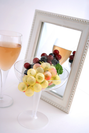 To use this stock image in your creative project, please select the size you need over to the right and click the "Add to Cart" button.
Your downloaded image will come with the Cutcaster watermark removed so don’t worry about the watermark you see on this page. Isolated Grapes In a Glass stock photo, Isolated Grapes In a Glass in front of a Mirror with a Glass of Wine by Mehmet Dilsiz
