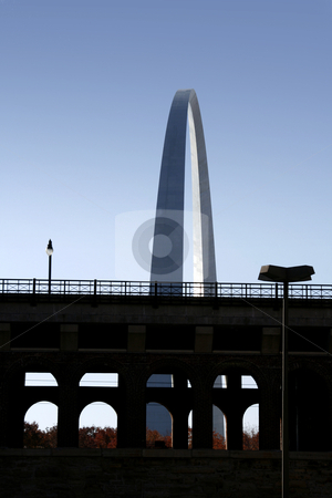 To use this stock image in your creative project, please select the size you need over to the right and click the "Add to Cart" button.
Your downloaded image will come with the Cutcaster watermark removed so don’t worry about the watermark you see on this page. The Arch at St. Louis from a street view stock photo, The Arch at St. Louis behind a bridge by Mehmet Dilsiz