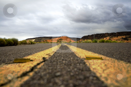 To use this stock image in your creative project, please select the size you need over to the right and click the "Add to Cart" button.
Your downloaded image will come with the Cutcaster watermark removed so don’t worry about the watermark you see on this page. Close up on a road in Snow Canyon Park stock photo, Road on the Snow Canyon in St. George, Utah by Mehmet Dilsiz