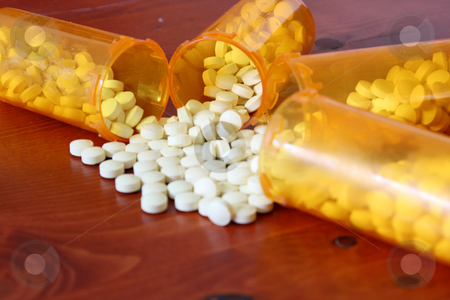 To use this stock image in your creative project, please select the size you need over to the right and click the "Add to Cart" button.
Your downloaded image will come with the Cutcaster watermark removed so don’t worry about the watermark you see on this page. Bottles of Medicine stock photo, Medicine spilling out of bottles by Mehmet Dilsiz