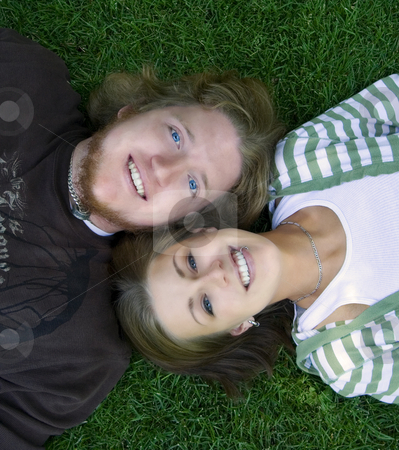 To use this stock image in your creative project, please select the size you need over to the right and click the "Add to Cart" button.
Your downloaded image will come with the Cutcaster watermark removed so don’t worry about the watermark you see on this page. Young couple looking at the camera laying down stock photo, Young Married Couple laying down looking up to the camera by Mehmet Dilsiz