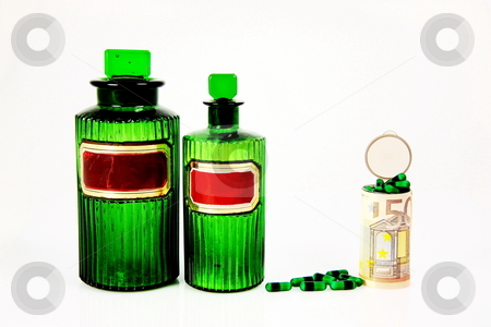 To use this stock image in your creative project, please select the size you need over to the right and click the "Add to Cart" button.
Your downloaded image will come with the Cutcaster watermark removed so don’t worry about the watermark you see on this page. Rising Medical Costs Euros stock photo, A conceptual image of rising medical costs with two green antique pharmacy bottles, green capsules and a euro banknote wrapped around a prescription bottle filled with capsules, isolated on white. by Gozzoli