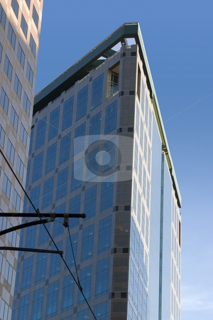 To use this stock image in your creative project, please select the size you need over to the right and click the "Add to Cart" button.
Your downloaded image will come with the Cutcaster watermark removed so don’t worry about the watermark you see on this page. Downtown Mirrored Buildings stock photo, Mirrored Business Building by Mehmet Dilsiz
