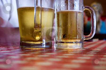 To use this stock image in your creative project, please select the size you need over to the right and click the "Add to Cart" button.
Your downloaded image will come with the Cutcaster watermark removed so don’t worry about the watermark you see on this page. Two Glasses of Beer stock photo, Close up on Two Glasses of Beer Sweating by Mehmet Dilsiz