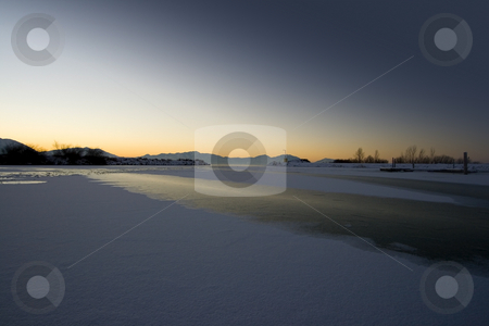 To use this stock image in your creative project, please select the size you need over to the right and click the "Add to Cart" button.
Your downloaded image will come with the Cutcaster watermark removed so don’t worry about the watermark you see on this page. Sunrise over the Frozen Lake stock photo, Sunrise over the Frozen Lake in Winter by Mehmet Dilsiz