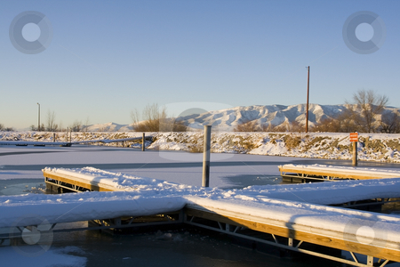 To use this stock image in your creative project, please select the size you need over to the right and click the "Add to Cart" button.
Your downloaded image will come with the Cutcaster watermark removed so don’t worry about the watermark you see on this page. Docks on the Frozen Lake stock photo, Dockson the Frozen Lake in Winter by Mehmet Dilsiz