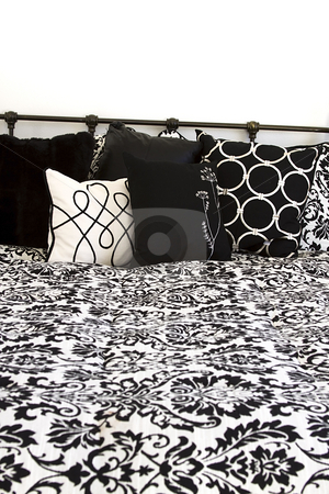 To use this stock image in your creative project, please select the size you need over to the right and click the "Add to Cart" button.
Your downloaded image will come with the Cutcaster watermark removed so don’t worry about the watermark you see on this page. Close up on the pillows in a bedroom stock photo, Pillows on a bed in the bedroom by Mehmet Dilsiz