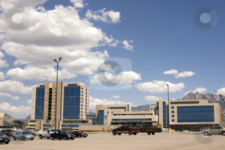 To use this stock image in your creative project, please select the size you need over to the right and click the "Add to Cart" button.
Your downloaded image will come with the Cutcaster watermark removed so don’t worry about the watermark you see on this page. Construction and the Parking Lot stock photo, Mirrored Construction Buildings and the Parking Lot with the Clouds in the Skies by Mehmet Dilsiz