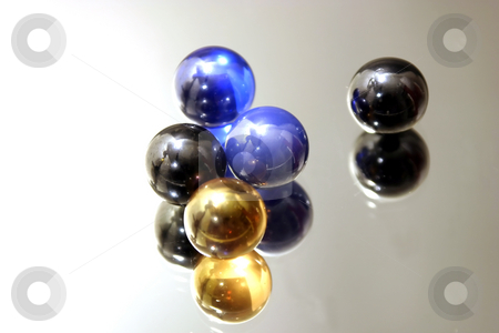 To use this stock image in your creative project, please select the size you need over to the right and click the "Add to Cart" button.
Your downloaded image will come with the Cutcaster watermark removed so don’t worry about the watermark you see on this page. Marbles on Mirror stock photo, Isolated Marbles on Mirror by Mehmet Dilsiz