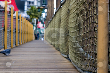 To use this stock image in your creative project, please select the size you need over to the right and click the "Add to Cart" button.
Your downloaded image will come with the Cutcaster watermark removed so don’t worry about the watermark you see on this page. Sidewalk in the strip in Las Vegas - Pirate / dock themed sidewa stock photo, Sidewalk in the strip in Las Vegas - Pirate / dock themed sidewalk DOF, close up on the ropes with pigeon and people on the background by Mehmet Dilsiz