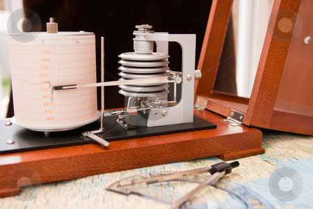 To use this stock image in your creative project, please select the size you need over to the right and click the "Add to Cart" button.
Your downloaded image will come with the Cutcaster watermark removed so don’t worry about the watermark you see on this page. Barograph stock photo, Barograph in a wooden box with the lid open standing on a map by Keith Wilson