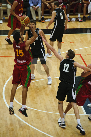 To use this stock image in your creative project, please select the size you need over to the right and click the "Add to Cart" button.
Your downloaded image will come with the Cutcaster watermark removed so don’t worry about the watermark you see on this page. FIBA Trentino Cup: Portugal vs New Zealand stock photo, Game 1 of FIBA Trentino Cup: Portugal vs New Zealand. The tournament was played in Trento (Italy) between the 25th and the 27th of July 2009. Portugal player Santos shoots from the arch for a 3 points basket. Photo taken on the 25th of July, 2009. by Alessandro Rizzolli
