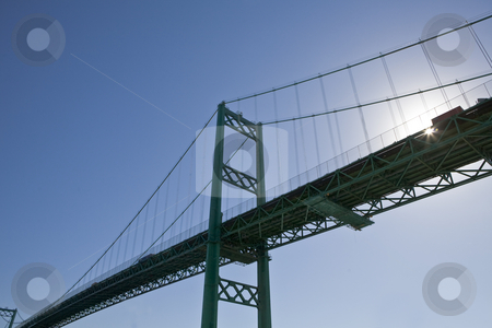To use this stock image in your creative project, please select the size you need over to the right and click the "Add to Cart" button.
Your downloaded image will come with the Cutcaster watermark removed so don’t worry about the watermark you see on this page. Vincent Thomas Bridge, Los Angeles Harbor stock photo, Sunburst on Viincent Thomas Bridge in view from below by Bart Everett