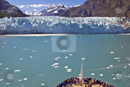 To use this stock image in your creative project, please select the size you need over to the right and click the "Add to Cart" button.
Your downloaded image will come with the Cutcaster watermark removed so don’t worry about the watermark you see on this page. Glacier Bay Cruise stock photo, A crowd gathers at the bow of a cruise ship as it approaches a glacier on the
Alaska coast in Gacier Bay. by Bart Everett
