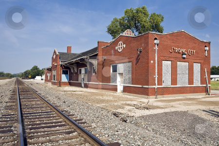 To use this stock image in your creative project, please select the size you need over to the right and click the "Add to Cart" button.
Your downloaded image will come with the Cutcaster watermark removed so don’t worry about the watermark you see on this page. Railroad Depot stock photo, Small-town railway station sits along a single track in Strong City, Kansas by Bart Everett
