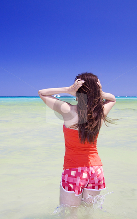 To use this stock image in your creative project, please select the size you need over to the right and click the "Add to Cart" button.
Your downloaded image will come with the Cutcaster watermark removed so don’t worry about the watermark you see on this page. Beautiful woman in the water stock photo, Latina woman going into the water at a nice beach in Sicily by Daniel Kafer