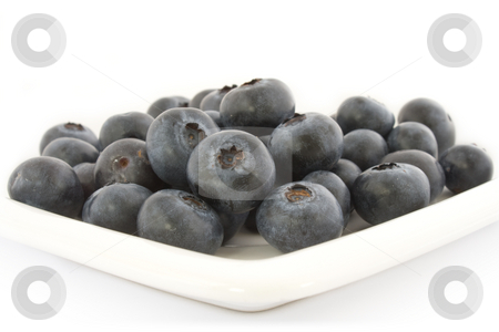To use this stock image in your creative project, please select the size you need over to the right and click the "Add to Cart" button.
Your downloaded image will come with the Cutcaster watermark removed so don’t worry about the watermark you see on this page. A plate with fresh blueberries stock photo, A plate with fresh blueberries isolated on white background, with shadow. by Natalia Banegas
