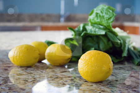 To use this stock image in your creative project, please select the size you need over to the right and click the "Add to Cart" button.
Your downloaded image will come with the Cutcaster watermark removed so don’t worry about the watermark you see on this page. Lemons and salad leaves on a kitchen countertop stock photo, Lemons and salad leaves on a kitchen countertop. by Natalia Banegas