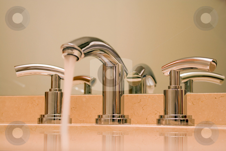 To use this stock image in your creative project, please select the size you need over to the right and click the "Add to Cart" button.
Your downloaded image will come with the Cutcaster watermark removed so don’t worry about the watermark you see on this page. Chrome faucet in luxury bathroom stock photo, Close up of shiny chrome faucet in modern luxury bathroom. by Natalia Banegas